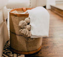how to artfully arrange throw blankets in a woven basket.jpeg