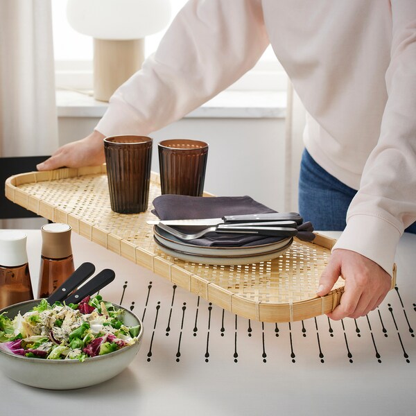 A Small Round Bamboo Tray Be 