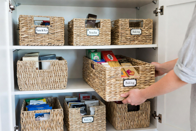Organised Kitchen Cupboard With Labeled Baskets.jpg